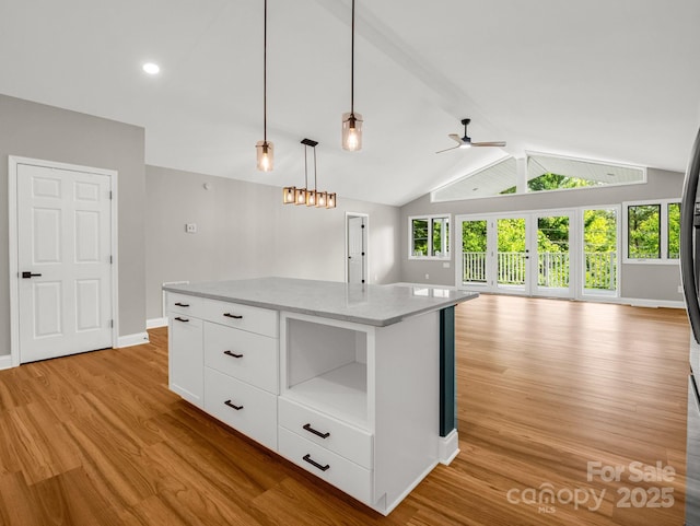 153 Old Lakey Gap Rd, Black Mountain, NC 28711 - kitchen with open floor plan, light wood finished floors, ceiling fan, white cabinetry, and baseboards