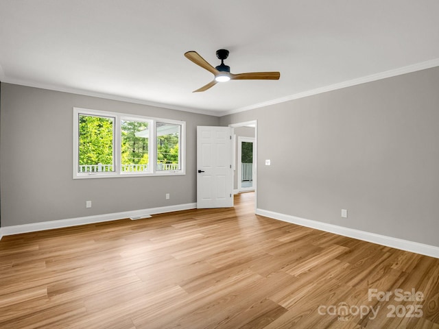 153 Old Lakey Gap Rd, Black Mountain, NC 28711 - unfurnished room with crown molding, ceiling fan, light wood-type flooring, and baseboards