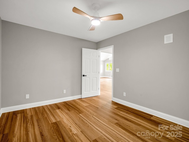 153 Old Lakey Gap Rd, Black Mountain, NC 28711 - spare room featuring light wood finished floors, baseboards, and ceiling fan