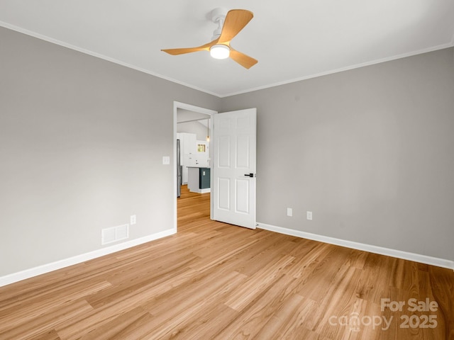 153 Old Lakey Gap Rd, Black Mountain, NC 28711 - unfurnished room featuring baseboards, light wood finished floors, ceiling fan, and ornamental molding