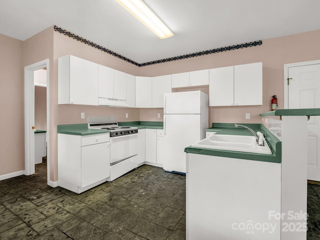 153 Old Lakey Gap Rd, Black Mountain, NC 28711 - kitchen featuring white appliances, under cabinet range hood, a sink, white cabinetry, and a peninsula