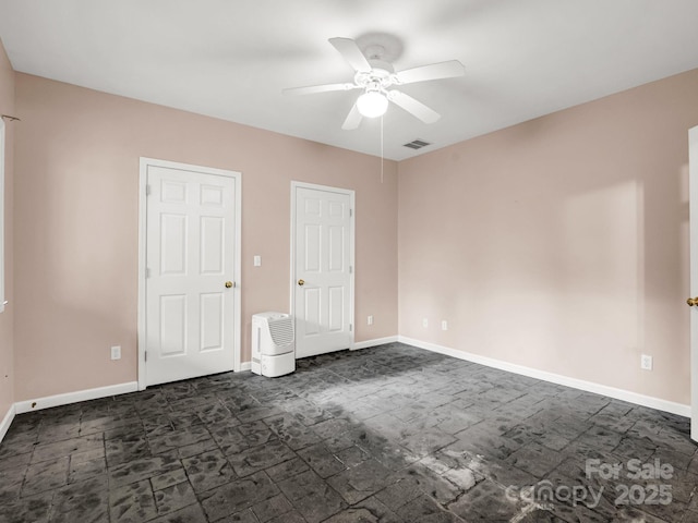 153 Old Lakey Gap Rd, Black Mountain, NC 28711 - unfurnished bedroom featuring dark colored carpet, baseboards, and a ceiling fan