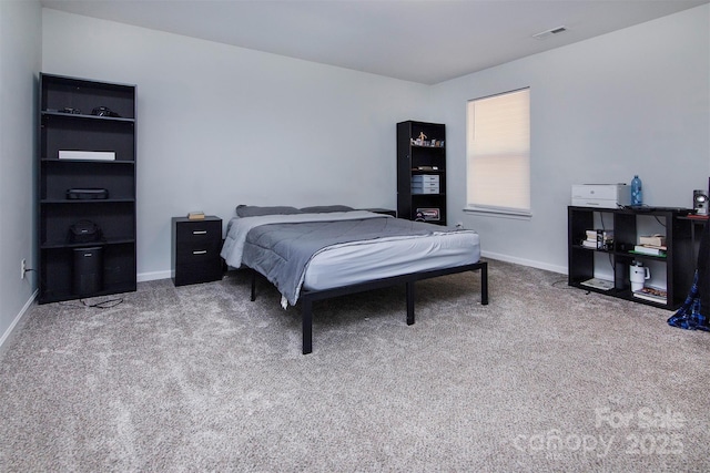 bedroom with visible vents, baseboards, and carpet floors
