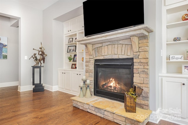5706 Sardis Hall Ct, Charlotte, NC 28270 - interior details with baseboards, a fireplace, built in shelves, and wood finished floors