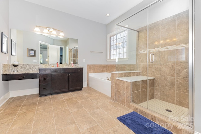 5706 Sardis Hall Ct, Charlotte, NC 28270 - bathroom featuring a garden tub, baseboards, vanity, and a shower stall