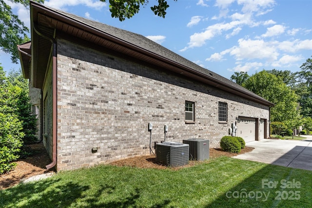 5706 Sardis Hall Ct, Charlotte, NC 28270 - view of side of home featuring a lawn, central AC unit, an attached garage, and concrete driveway