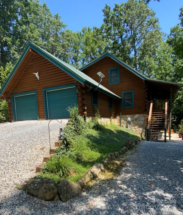 2245 Mckenzie Way N Unit 754, Old Fort, NC 28762 - log cabin featuring log exterior, stairs, driveway, and an attached garage