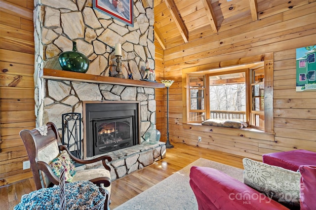 2245 Mckenzie Way N Unit 754, Old Fort, NC 28762 - living area featuring wood ceiling, wood walls, wood finished floors, and a stone fireplace