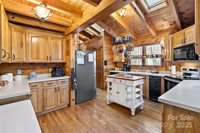 2245 Mckenzie Way N Unit 754, Old Fort, NC 28762 - kitchen with appliances with stainless steel finishes, a skylight, wood ceiling, light wood finished floors, and light countertops