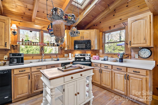2245 Mckenzie Way N Unit 754, Old Fort, NC 28762 - kitchen with black appliances, wooden ceiling, a skylight, light wood-type flooring, and wood walls