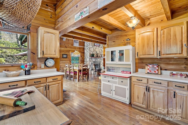 2245 Mckenzie Way N Unit 754, Old Fort, NC 28762 - kitchen with wood walls, healthy amount of natural light, light brown cabinetry, light countertops, and a wood ceiling with exposed beams