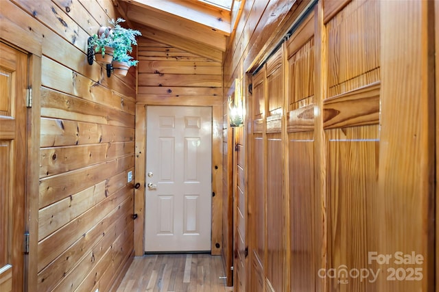 2245 Mckenzie Way N Unit 754, Old Fort, NC 28762 - entryway with wooden walls, lofted ceiling, light wood-style floors, and a skylight
