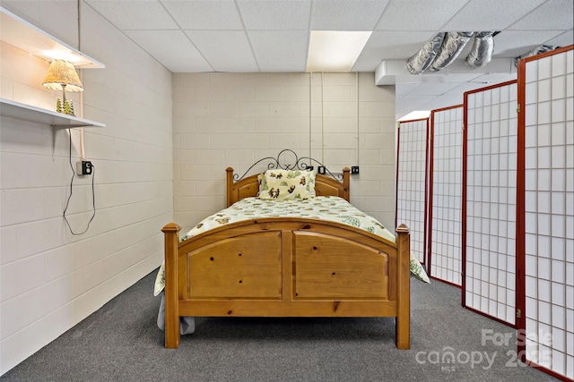 2245 Mckenzie Way N Unit 754, Old Fort, NC 28762 - bedroom with a drop ceiling, dark carpet, and concrete block wall