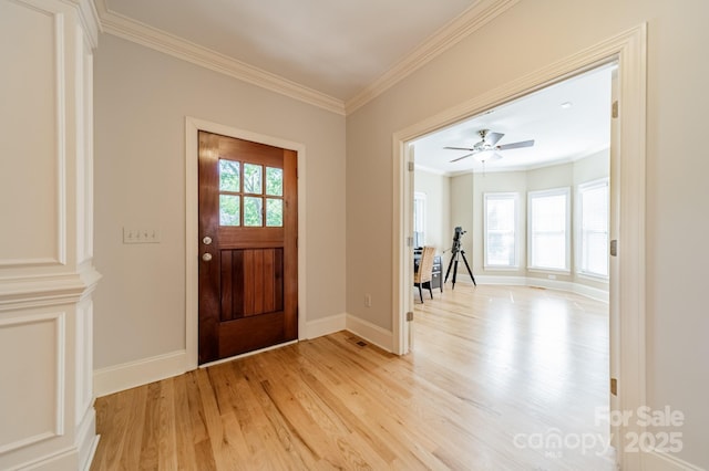 4599 Rustling Woods Dr, Denver, NC 28037 - foyer featuring light wood-style floors, ornamental molding, and baseboards
