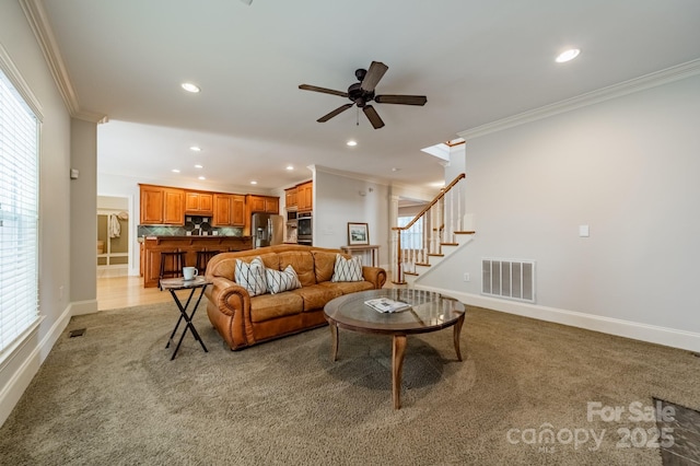 4599 Rustling Woods Dr, Denver, NC 28037 - living area featuring ornamental molding, light carpet, recessed lighting, baseboards, and ceiling fan