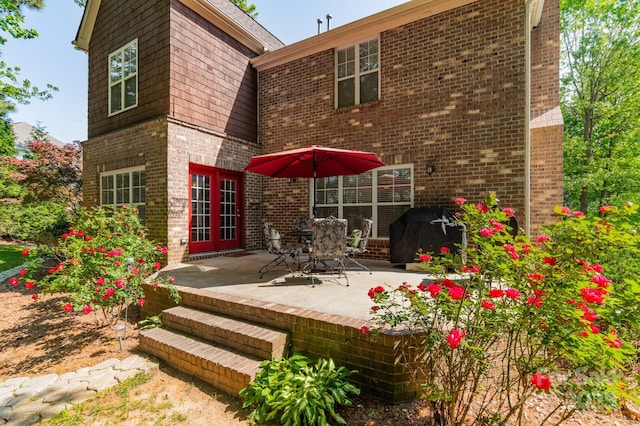 4599 Rustling Woods Dr, Denver, NC 28037 - rear view of property with a patio area and brick siding