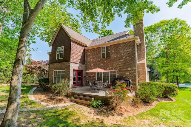 4599 Rustling Woods Dr, Denver, NC 28037 - back of property featuring a chimney, brick siding, french doors, a patio, and a yard