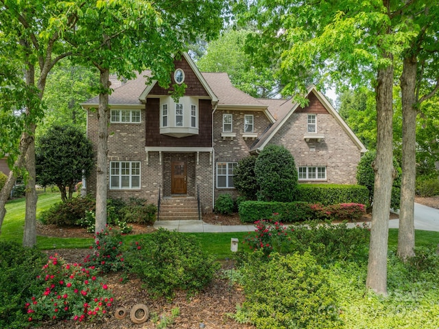 4599 Rustling Woods Dr, Denver, NC 28037 - view of front of property with brick siding and roof with shingles