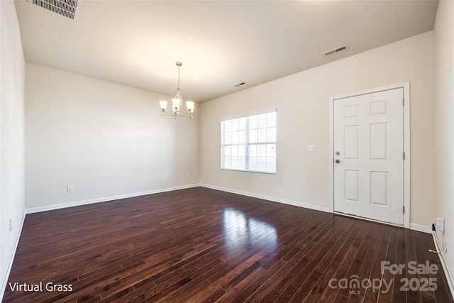 1929 Shorthorn St, Charlotte, NC 28213 - unfurnished room featuring dark wood-style flooring, a notable chandelier, baseboards, and visible vents