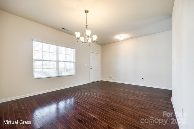 1929 Shorthorn St, Charlotte, NC 28213 - empty room with dark wood-type flooring, baseboards, visible vents, and a notable chandelier