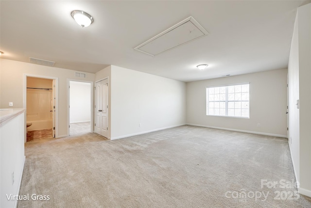 1929 Shorthorn St, Charlotte, NC 28213 - unfurnished room featuring attic access, light colored carpet, visible vents, and baseboards