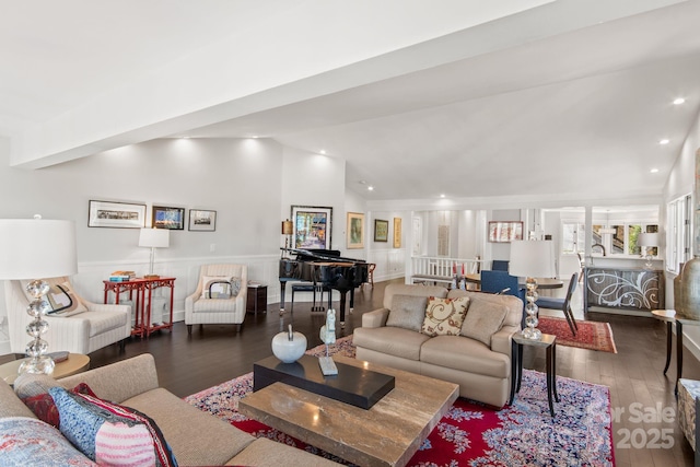 living room with lofted ceiling, recessed lighting, wainscoting, and wood-type flooring