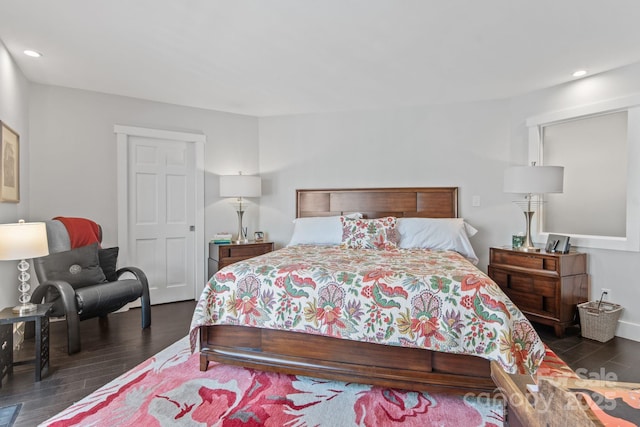 bedroom featuring dark wood-style flooring and recessed lighting