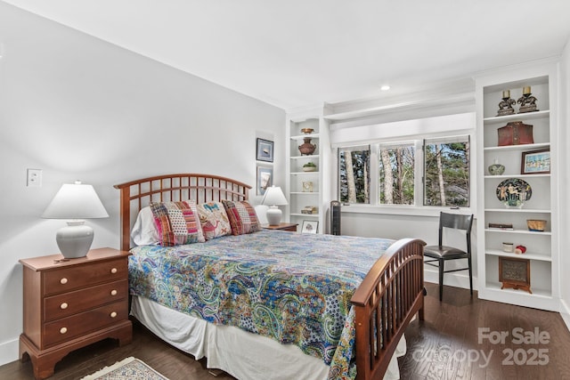 bedroom featuring recessed lighting and wood finished floors