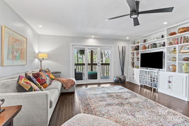 living room with a ceiling fan, recessed lighting, and dark wood-style flooring