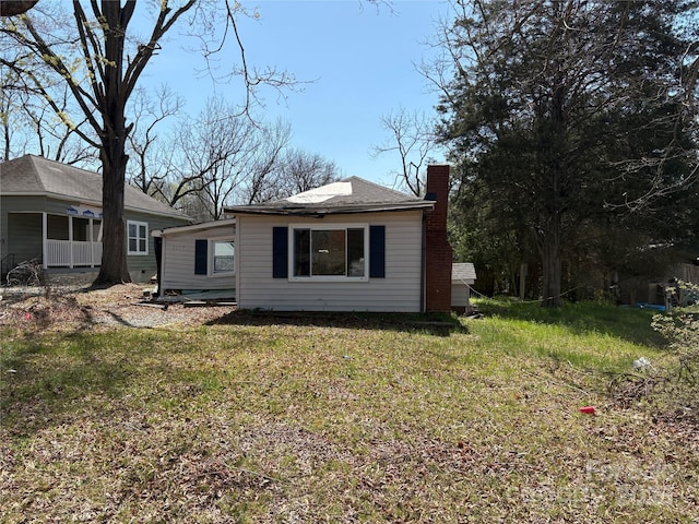 1407 Birch St, Kannapolis, NC 28081 - rear view of house featuring a chimney and a lawn