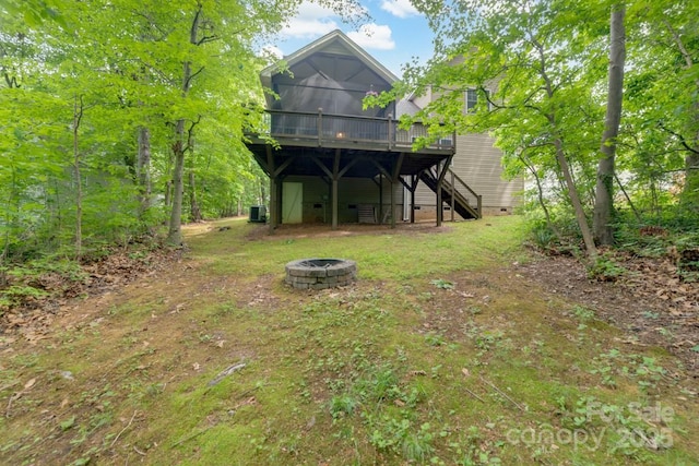 6414 Winding Creek Ln, Denver, NC 28037 - back of property with a fire pit, a wooden deck, stairs, and crawl space