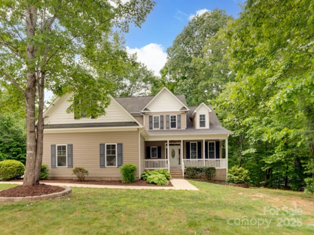 6414 Winding Creek Ln, Denver, NC 28037 - view of front facade featuring a porch and a front lawn