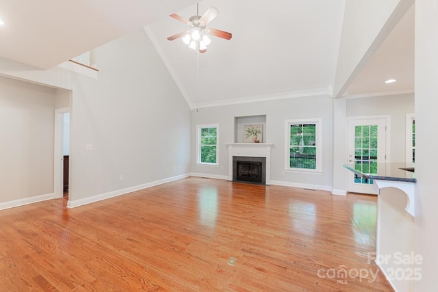 6414 Winding Creek Ln, Denver, NC 28037 - unfurnished living room featuring high vaulted ceiling, light wood finished floors, ceiling fan, baseboards, and a fireplace