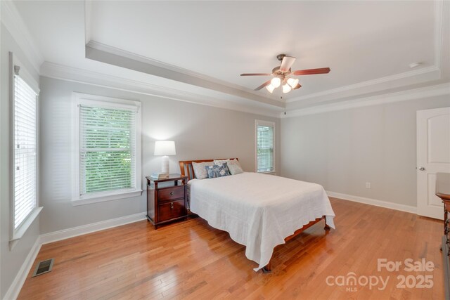 6414 Winding Creek Ln, Denver, NC 28037 - bedroom with a raised ceiling, crown molding, light wood-type flooring, baseboards, and ceiling fan