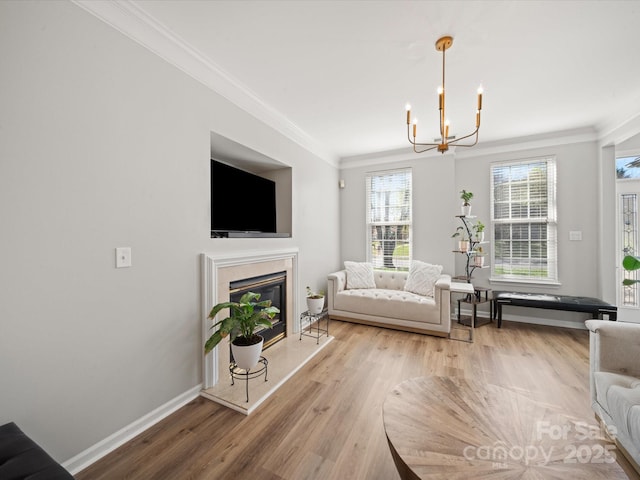 14802 Rolling Sky Dr, Charlotte, NC 28273 - living area featuring ornamental molding, baseboards, light wood-style floors, and a chandelier