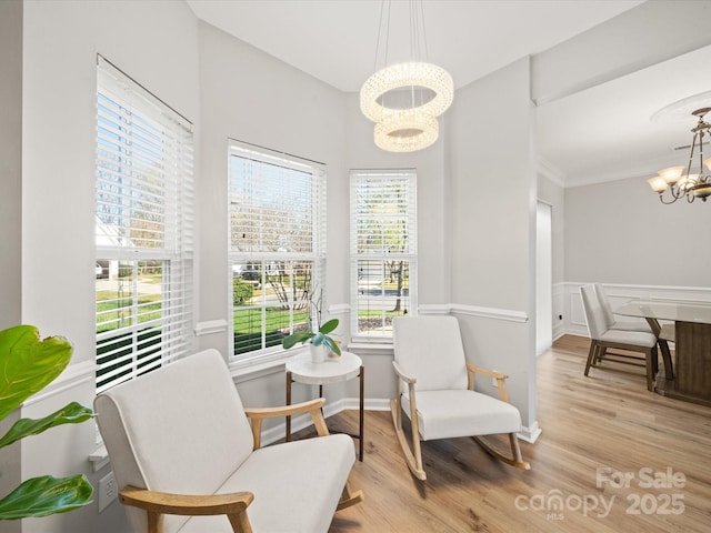 14802 Rolling Sky Dr, Charlotte, NC 28273 - sitting room with baseboards, ornamental molding, wood finished floors, and a chandelier