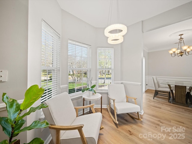 14802 Rolling Sky Dr, Charlotte, NC 28273 - living area with crown molding, light wood-style floors, and a chandelier