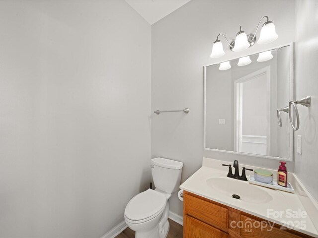14802 Rolling Sky Dr, Charlotte, NC 28273 - bathroom featuring baseboards, toilet, and vanity
