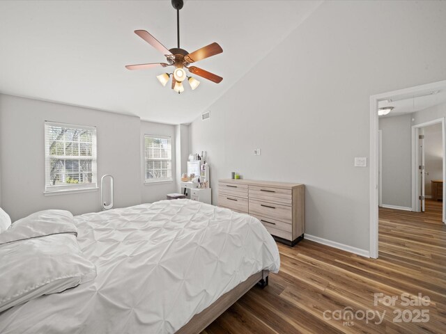 14802 Rolling Sky Dr, Charlotte, NC 28273 - bedroom featuring attic access, lofted ceiling, baseboards, visible vents, and wood finished floors