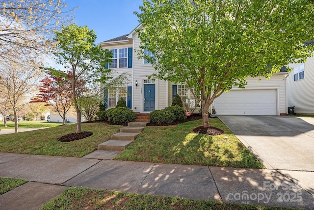 view of front facade featuring a front yard, a garage, and concrete driveway