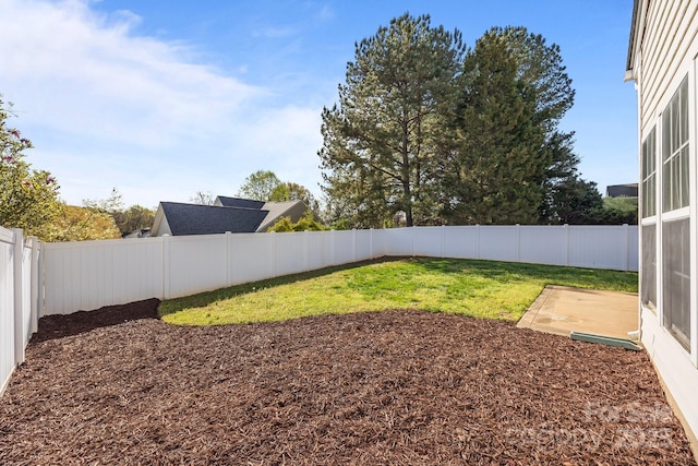 view of yard with a fenced backyard
