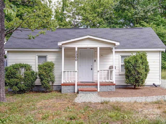 2300 Kennesaw Dr, Charlotte, NC 28216 - view of front facade with roof with shingles and covered porch