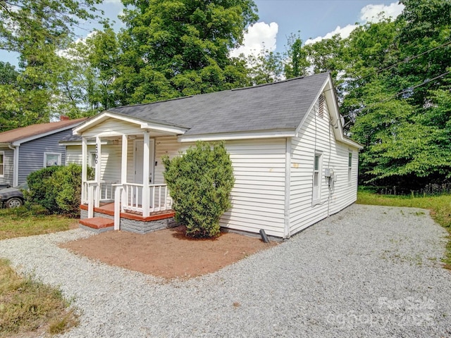2300 Kennesaw Dr, Charlotte, NC 28216 - view of front facade featuring a shingled roof and a porch