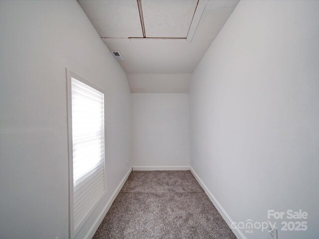 2300 Kennesaw Dr, Charlotte, NC 28216 - spare room featuring attic access, baseboards, and carpet