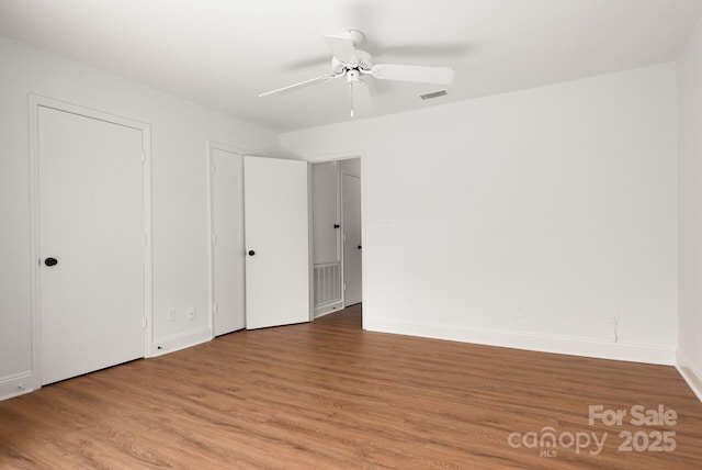 3709 Willow Point Dr, Charlotte, NC 28277 - spare room featuring baseboards, visible vents, a ceiling fan, and wood finished floors