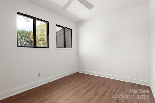 3709 Willow Point Dr, Charlotte, NC 28277 - spare room with baseboards, ceiling fan, and dark wood finished floors