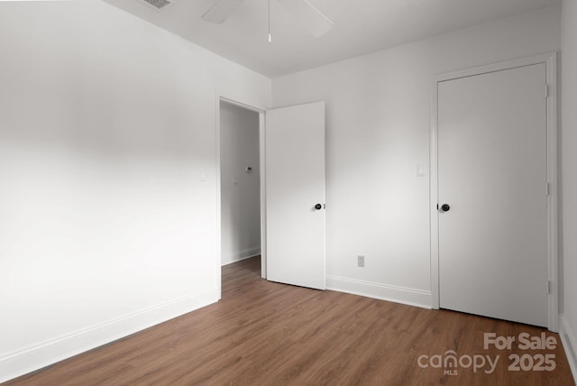 3709 Willow Point Dr, Charlotte, NC 28277 - unfurnished bedroom featuring baseboards, wood finished floors, and a ceiling fan