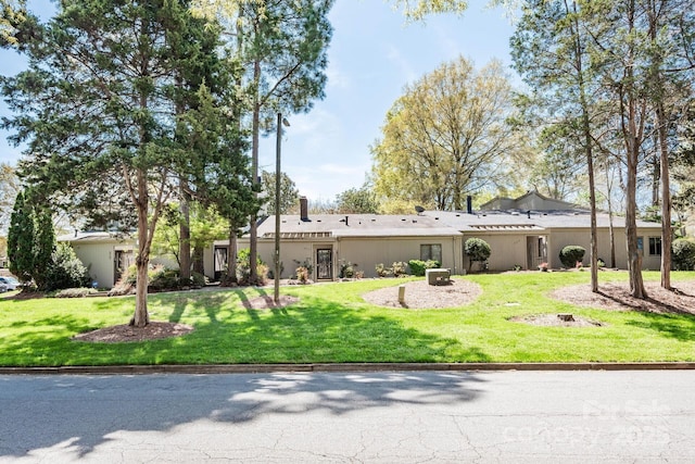 3709 Willow Point Dr, Charlotte, NC 28277 - rear view of property featuring a lawn and stucco siding