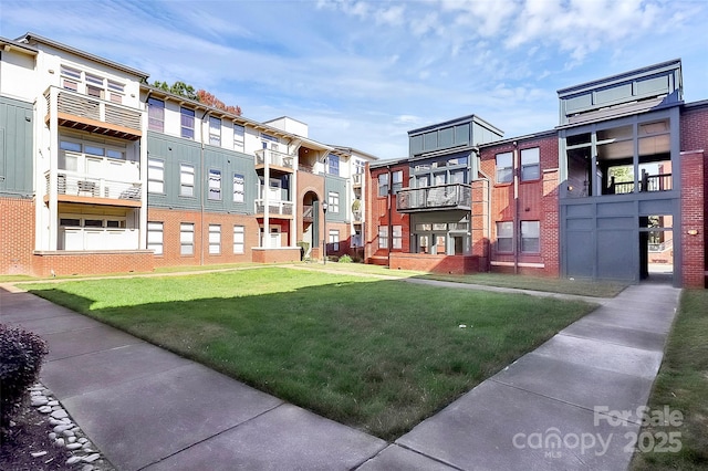 surrounding community with a lawn