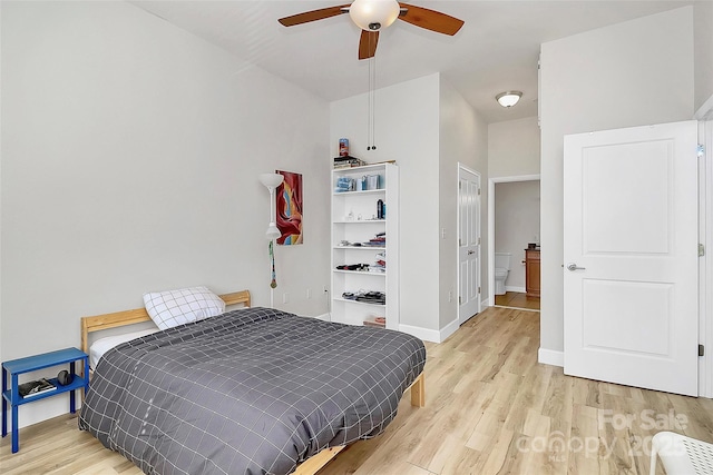 bedroom featuring baseboards, ceiling fan, and light wood-type flooring